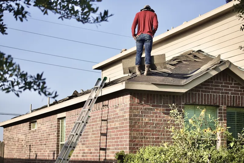 Professional roofer working on a residential roof in Montreal